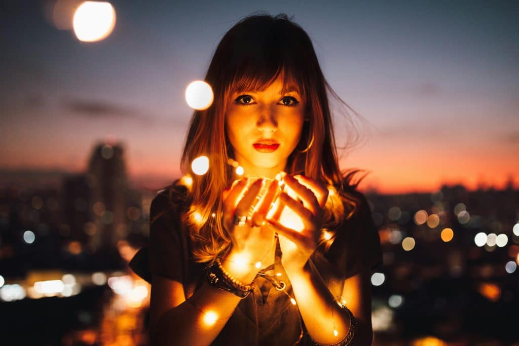 woman holding lights outside