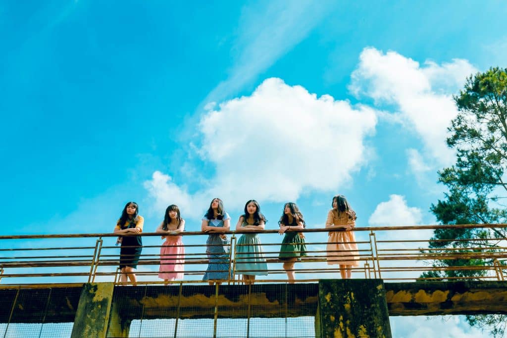 group of women on a bridge