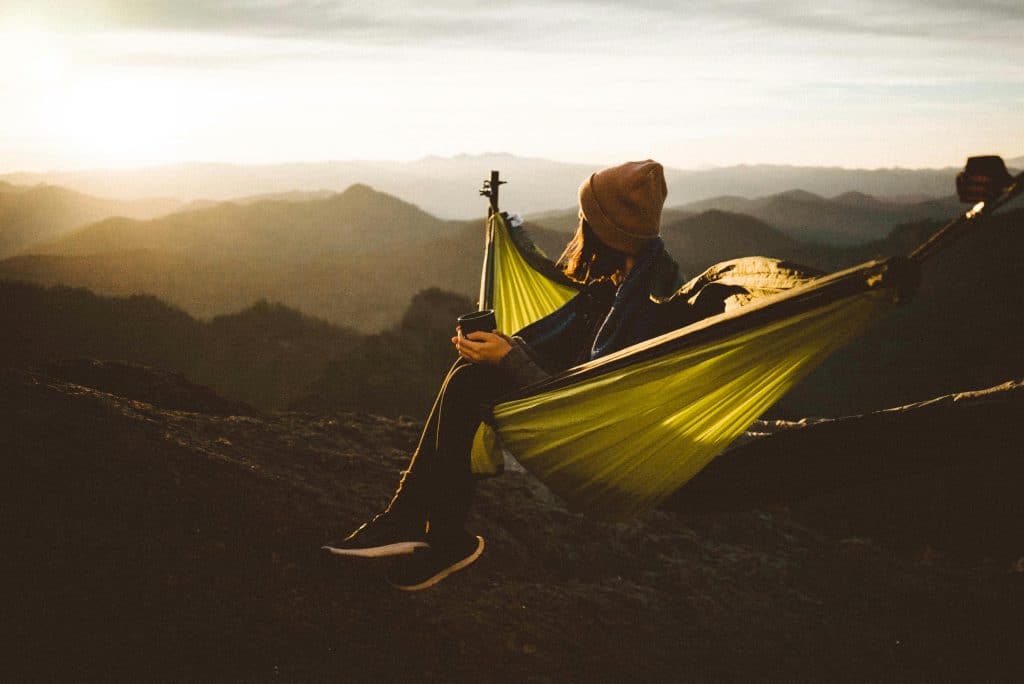 woman sitting in a hammock