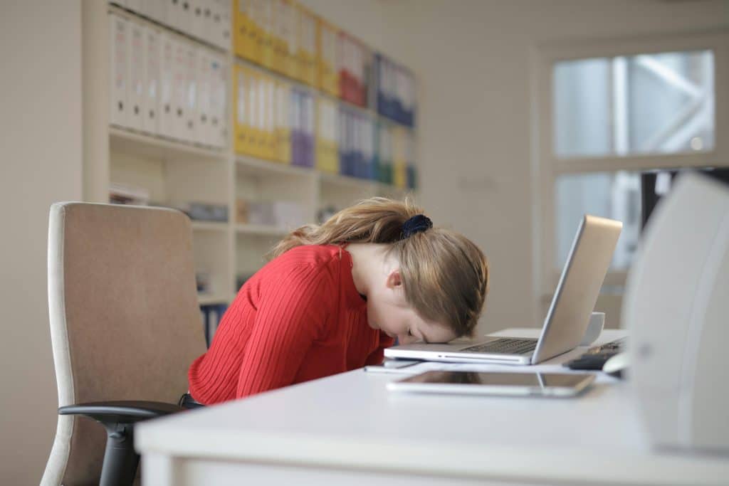 young woman struggling with work