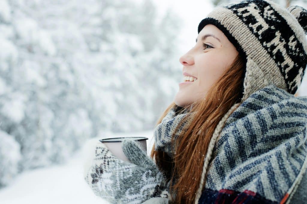woman in the snow smiling